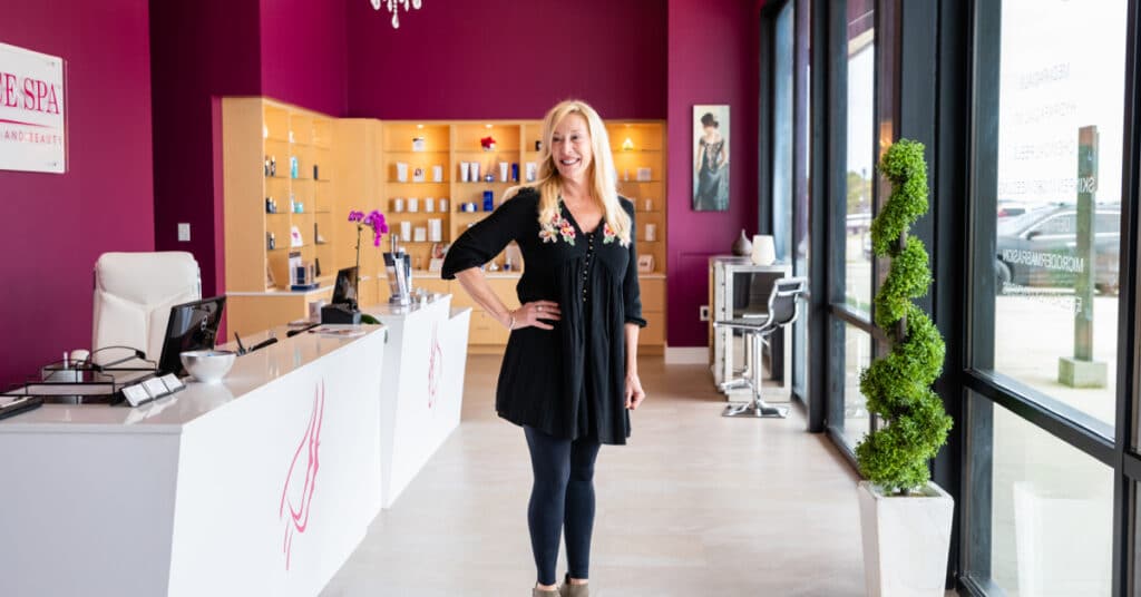 a woman standing in front of a store